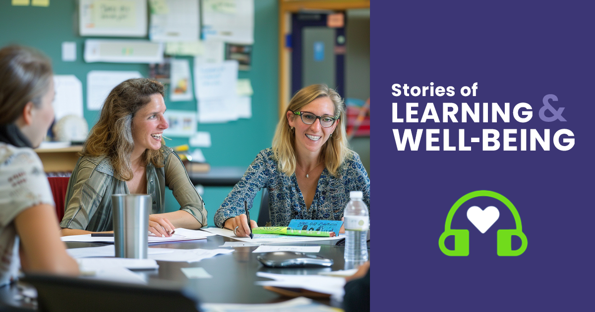 Three teachers working in classroom together.