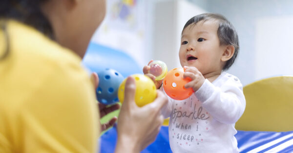 Child playing with caregiver