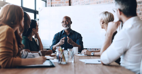 Several administrators and leaders in conversation