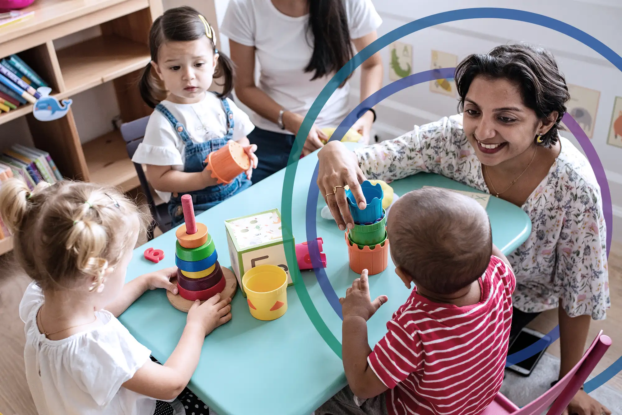 Image of caregiver interacting with three children seated at a table