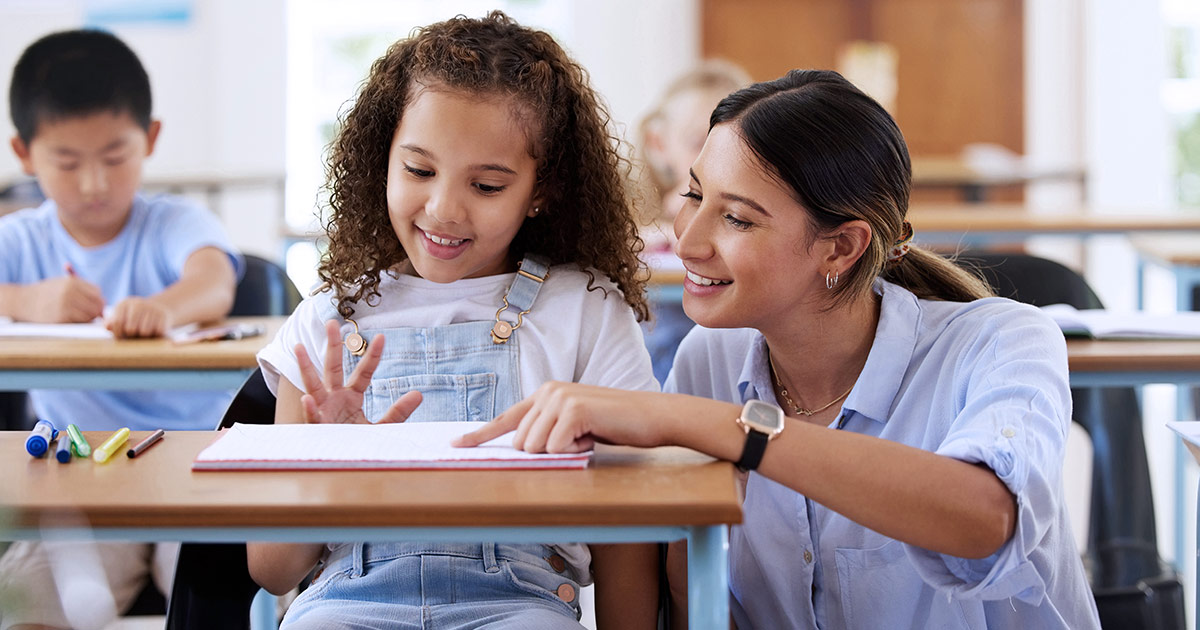 Teacher working one on one with a student