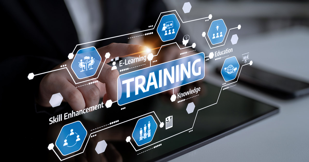 Illustration of workforce training concepts, including e-learning, education, and skill enhancement, overlaid on an image of a hand pointing at a tablet.