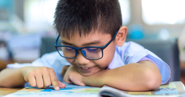 An elementary school student reading