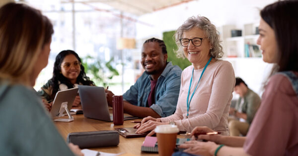 Teachers working together in a PLC