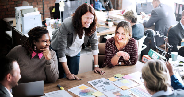 Education leaders in conversation around a table