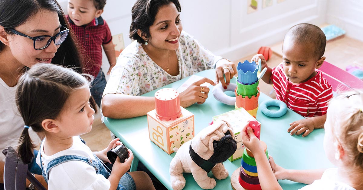 Toddlers and caregivers in a learning environment