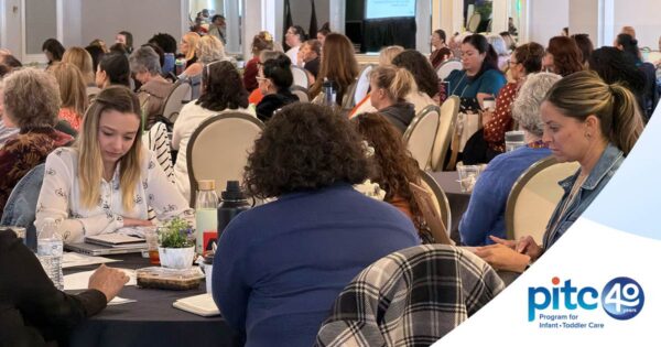 Photograph of infant/toddler care professionals in discussion at PITC's 40th anniversary conference in 2026